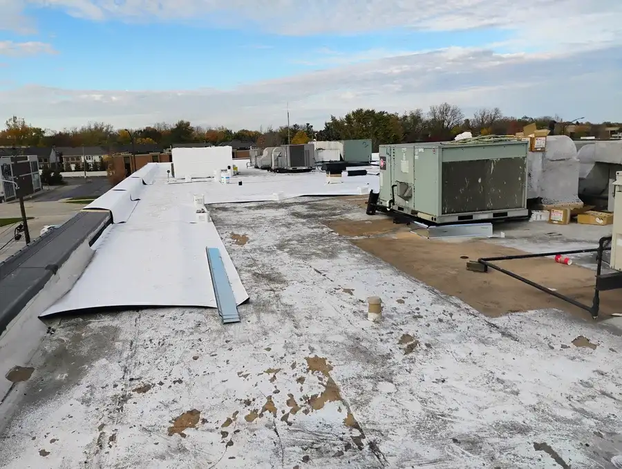 Partial commercial flat roof replacement in progress in Oakland County