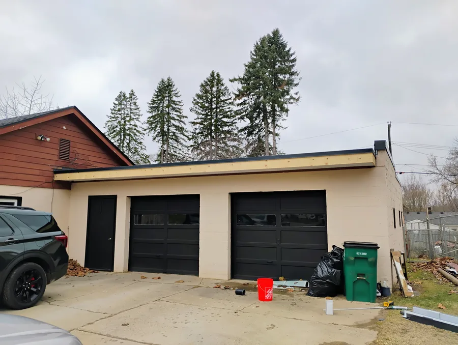 Street-level view of completed EPDM flat roof garage after installation, Metro Detroit