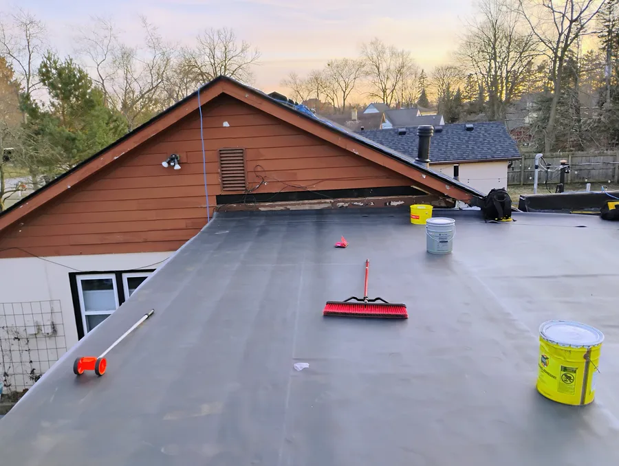 Completed EPDM flat roof at sunset in Oakland County Michigan